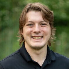 Headshot of Tristan Hewitt for 2026 Annual Conference.